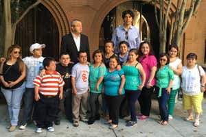 Two of the researchers with several of the study participants, who have Laron syndrome